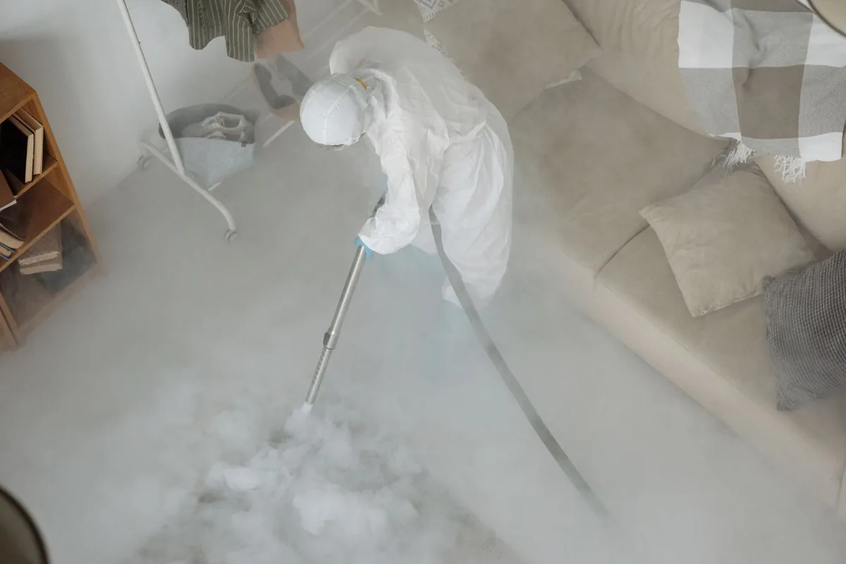 Biohazard cleanup technician in protective equipment, Milton, FL